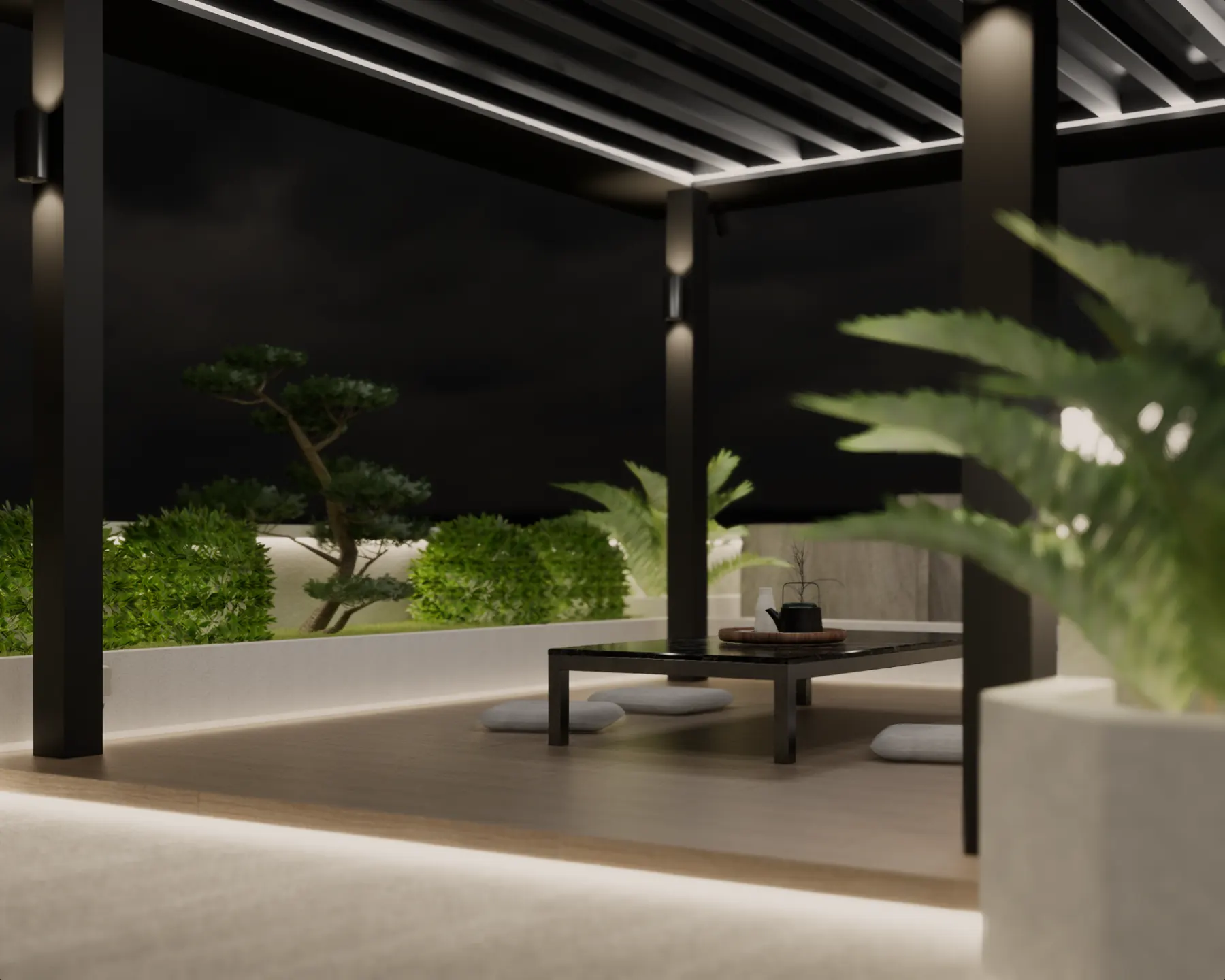 Covered terrace at night with a low table and planting