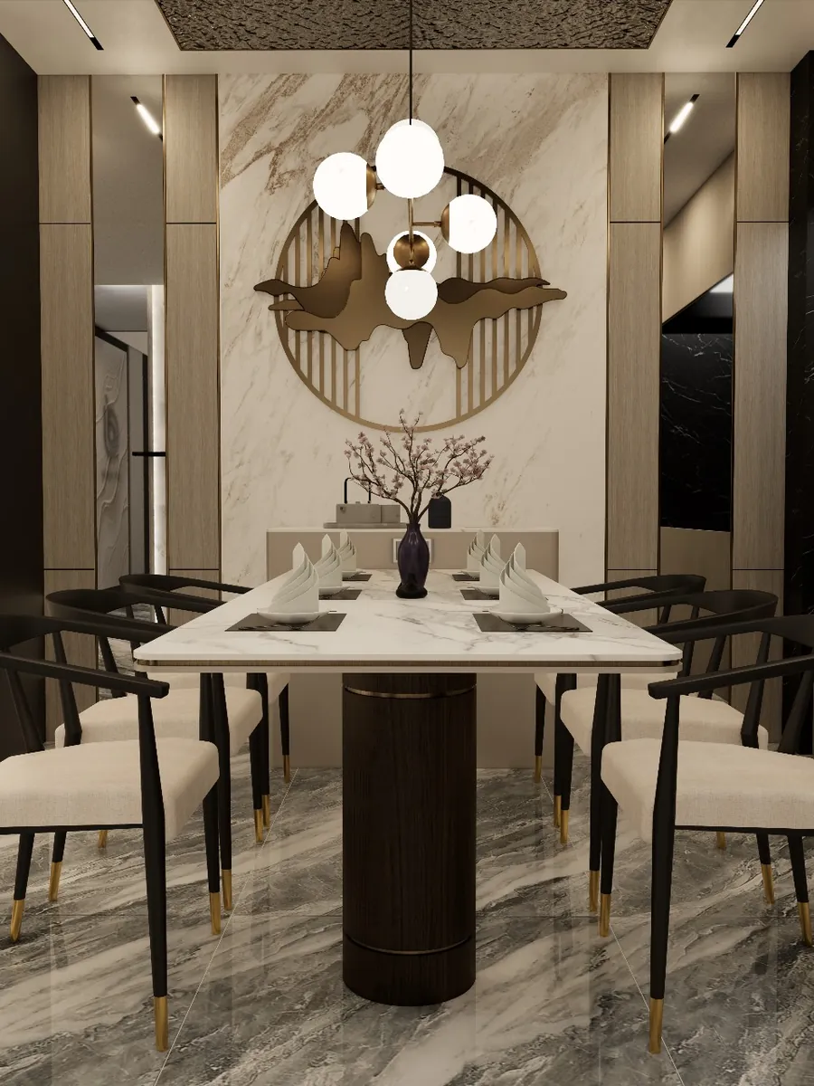Dining room with a round brass wall piece above a marble table